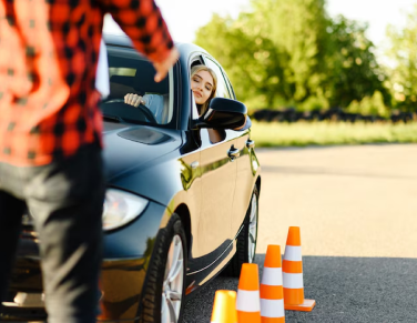 A beautiful girl learning how to drive